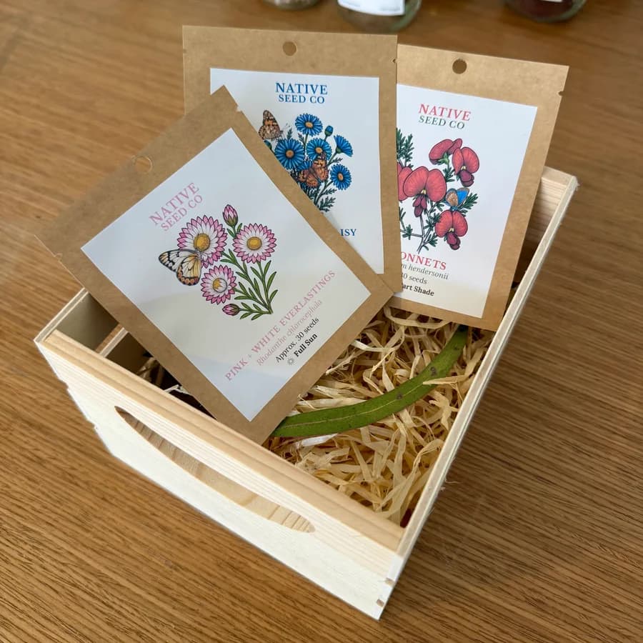 The Butterfly Bundle's three seed packets in a timber crate